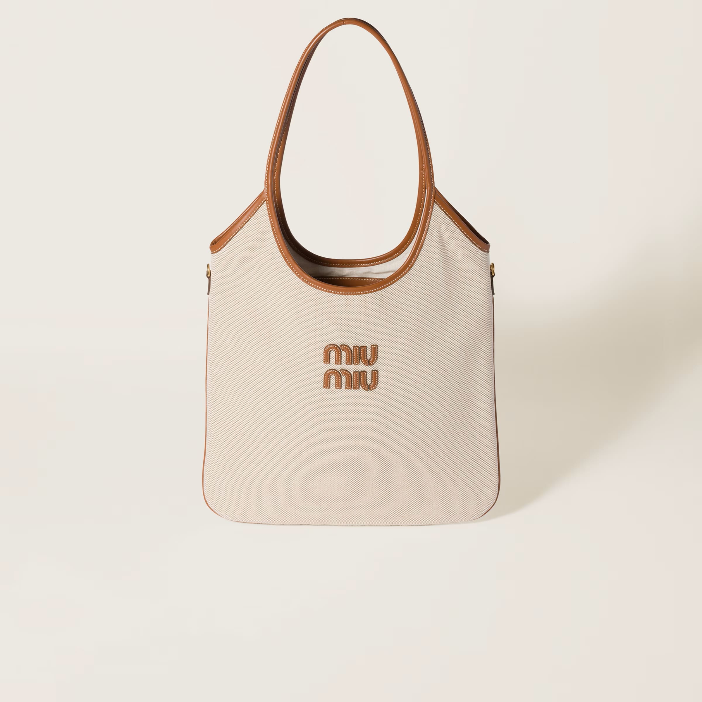 IVY canvas and leather bag - Regular, SGD 2650 (approximately P116,886.31), MIU MIU, miumiu.com